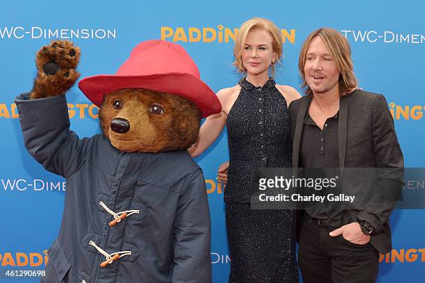 Actress Nicole Kidman and musician Keith Urban arrive with "Paddington" on the red carpet for the premiere of TWC-Dimension's "Paddington" at TCL...