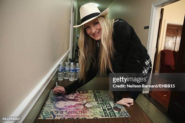 Holly Williams signs autographs backstage prior to The Life & Songs of Emmylou Harris: An All Star Concert Celebration at DAR Constitution Hall on...