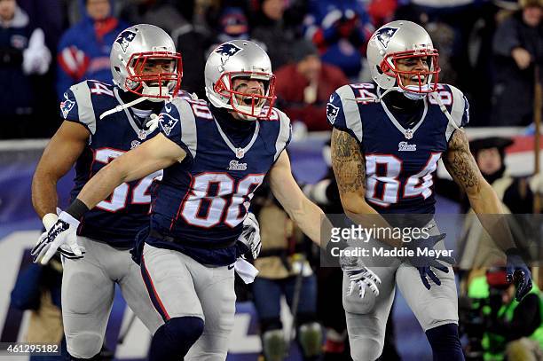 Danny Amendola of the New England Patriots celebrates with teammates after scoring a third quarter touchdown against the Baltimore Ravens during the...