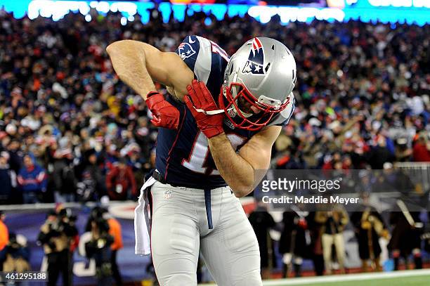 Julian Edelman of the New England Patriots celebrates after throwing a touchdown pass in the third quarter against the Baltimore Ravens during the...