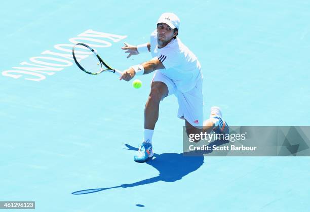 Fernando Verdasco of Spain plays a backhand during his match against Tomas Berdych of the Czech Republic during day one of the 2014 AAMI Classic at...