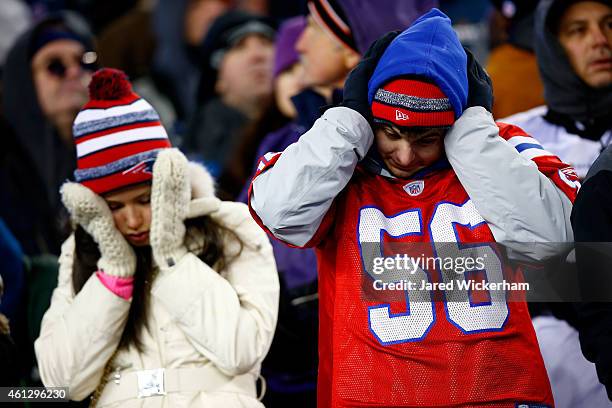 Fans react during the 2015 AFC Divisional Playoffs game between the New England Patriots and the Baltimore Ravens at Gillette Stadium on January 10,...