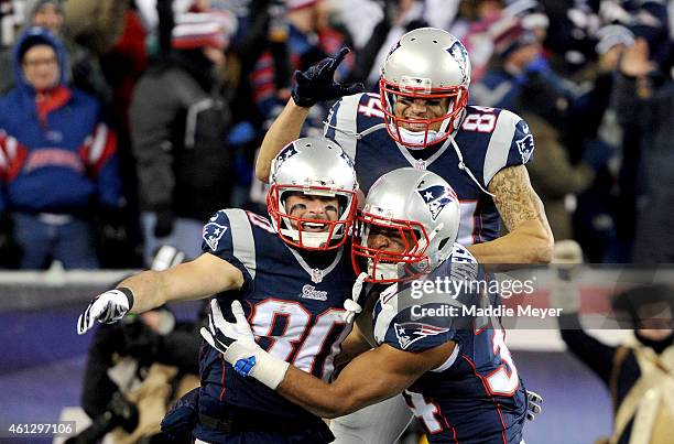 Brian Tyms, Shane Vereen, and Julian Edelman of the New England Patriots react after Edelman caught a touchdown pass during the second half of the...