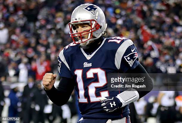 Tom Brady of the New England Patriots reacts after throwing a touchdown pass during the fourth quarter of the 2015 AFC Divisional Playoffs game...