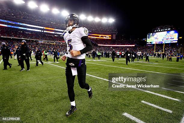 Joe Flacco of the Baltimore Ravens jogs off the field following the 2015 AFC Divisional Playoffs game against the New England Patriots at Gillette...