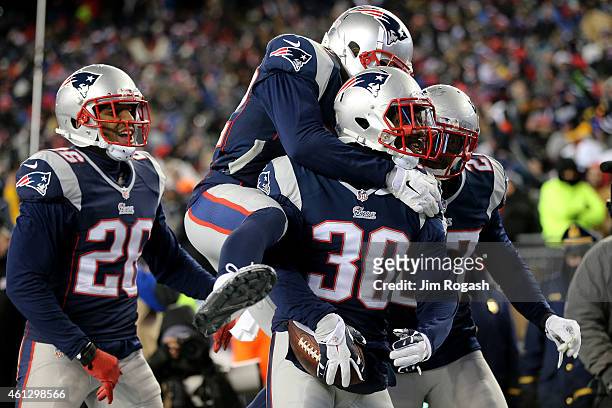 Duron Harmon of the New England Patriots reacts after intercepting a pass late in the game during the 2015 AFC Divisional Playoffs game against the...