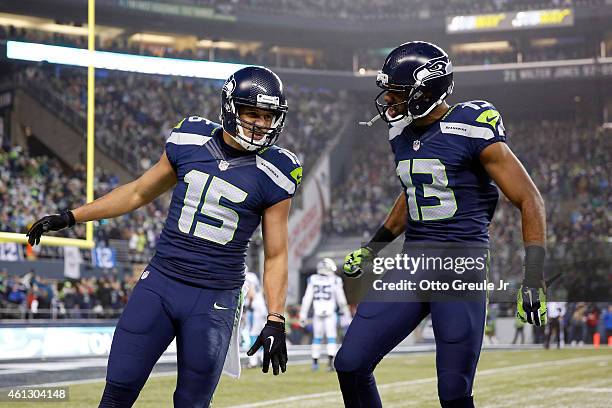Jermaine Kearse of the Seattle Seahawks celebrates with Chris Matthews after scoring a 63 yard touchdown in the second quarter against the Carolina...