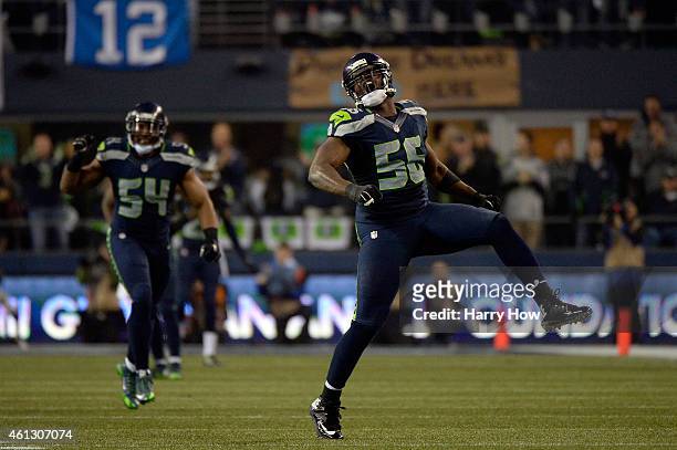 Cliff Avril of the Seattle Seahawks celebrates sacking Cam Newton of the Carolina Panthers in the third quarter during the 2015 NFC Divisional...