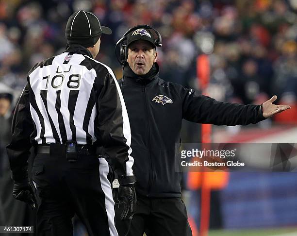 Baltimore Ravens head coach John Harbaugh argues an unnecessary roughness call on his team with the officials during the AFC Divisional Playoff Game...