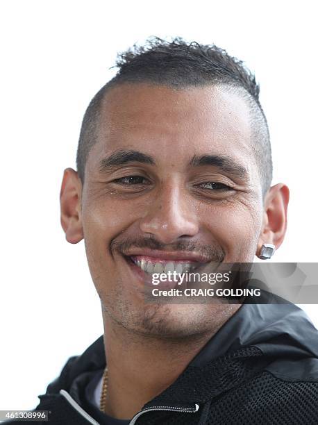 Nick Kyrgios of Australia laughs during an interview on day one of the Sydney International tennis tournament in Sydney on January 11, 2015. AFP...