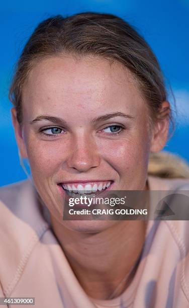Caroline Wozniaki of Denmark smiles during a press conference on day one of the Sydney International tennis tournament in Sydney on January 11, 2015....
