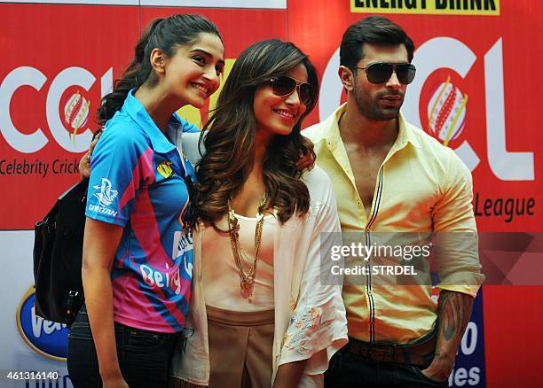 Indian Bollywood actors Sonam Kapoor , Bipasha Basu and Karan Singh pose for a photograph during the Celebrity Cricket League season five in Mumbai...