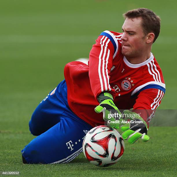 Goalkeeper Manuel Neuer makes a save during day 3 of the Bayern Muenchen training camp at ASPIRE Academy for Sports Excellence on January 11, 2015 in...