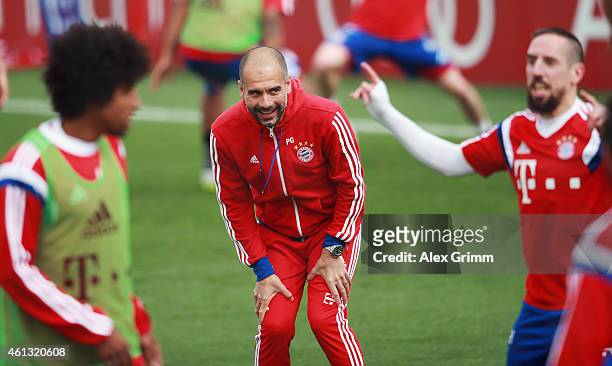 Head coach Pep Guardiola reacts during day 3 of the Bayern Muenchen training camp at ASPIRE Academy for Sports Excellence on January 11, 2015 in...
