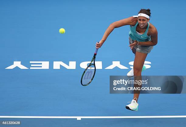 Madison Keys of theserves against Svetlana Kuznetsova of Russia on day one of the Sydney International tennis tournament in Sydney on January 11,...