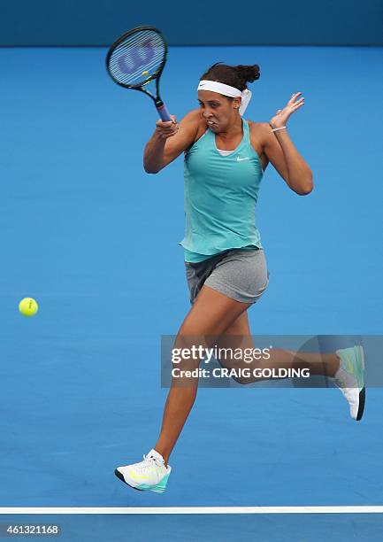 Madison Keys of the US hits a baseline shot against Svetlana Kuznetsova of Russia on day one of the Sydney International tennis tournament in Sydney...