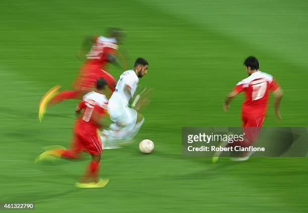 Ashkan Dejagah of Iran runs with the ball during the 2015 Asian Cup match between IR Iran and Bahrain at AAMI Park on January 11, 2015 in Melbourne,...