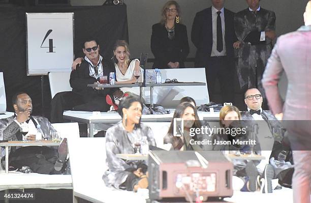 Honoree Amber Heard and actor Johnny Depp attend the 8th Annual HEAVEN Gala presented by Art of Elysium and Samsung Galaxy at Hangar 8 on January 10,...