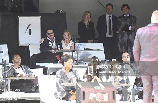 Honoree Amber Heard and actor Johnny Depp attend the 8th Annual HEAVEN Gala presented by Art of Elysium and Samsung Galaxy at Hangar 8 on January 10,...