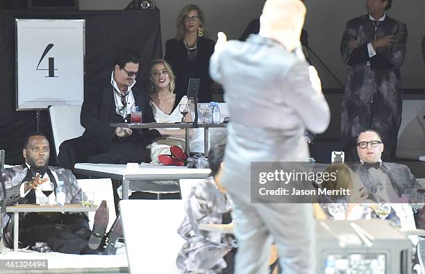 Honoree Amber Heard and actor Johnny Depp attend the 8th Annual HEAVEN Gala presented by Art of Elysium and Samsung Galaxy at Hangar 8 on January 10,...