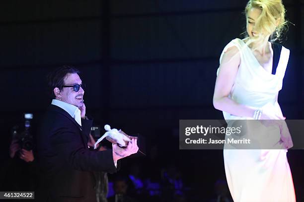 Honoree Amber Heard and actor Johnny Depp attend the 8th Annual HEAVEN Gala presented by Art of Elysium and Samsung Galaxy at Hangar 8 on January 10,...