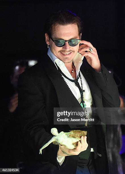 Honoree Amber Heard and actor Johnny Depp attend the 8th Annual HEAVEN Gala presented by Art of Elysium and Samsung Galaxy at Hangar 8 on January 10,...