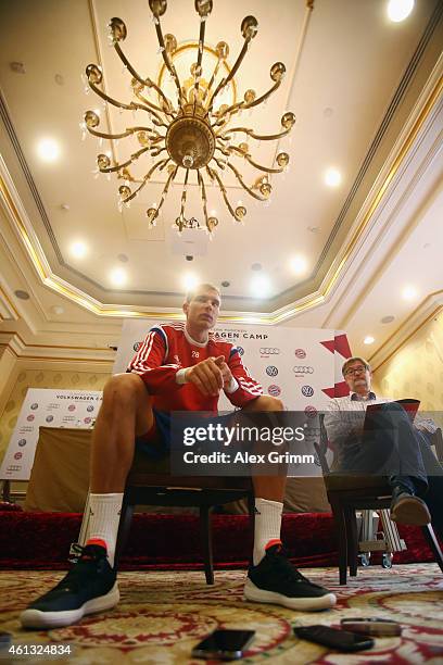 Holger Badstuber talks to the media during day 3 of the Bayern Muenchen training camp at ASPIRE Academy for Sports Excellence on January 11, 2015 in...