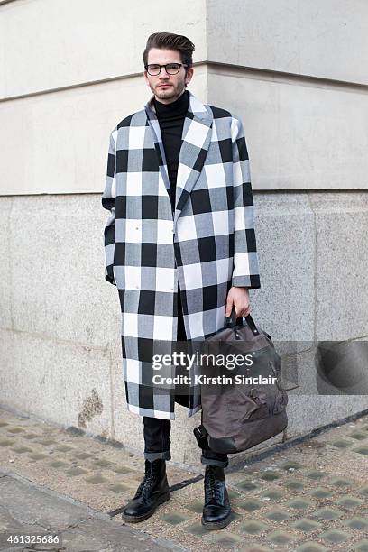 Musician Harry Hudson-Tailor wearing an Aggy and Sam jacket, Topman jeans, Doctor Martins boots, Cubitts glasses and an Ally Capolino bag on day 2 of...