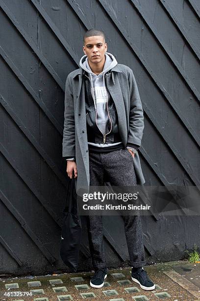 Model Zakaria Khiare wearing a Soulland coat and trousers, Nike trainers and a Woodward jacket on day 2 of London Collections: Men on January 10,...