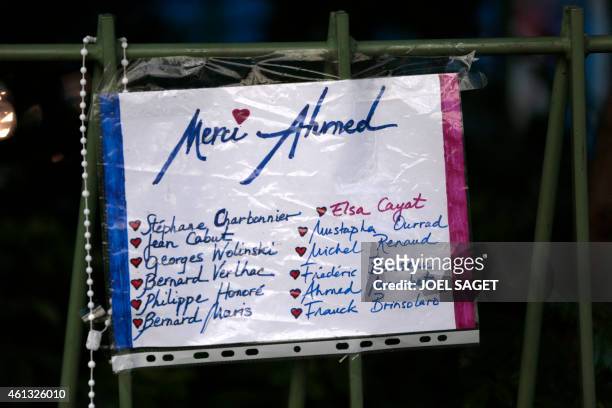 Sign which reads, "Thank you Ahmed" referring to the police officer Ahmed Merabet shot outside the office of Charlie Hebdo, the satirical magazine...