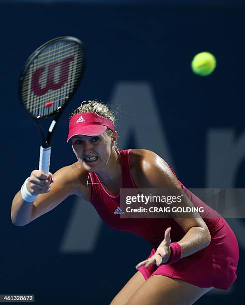Kristina Mladenovic of France plays a forehand against Johanna Konta of Britain on day one of the Sydney International tennis tournament in Sydney on...