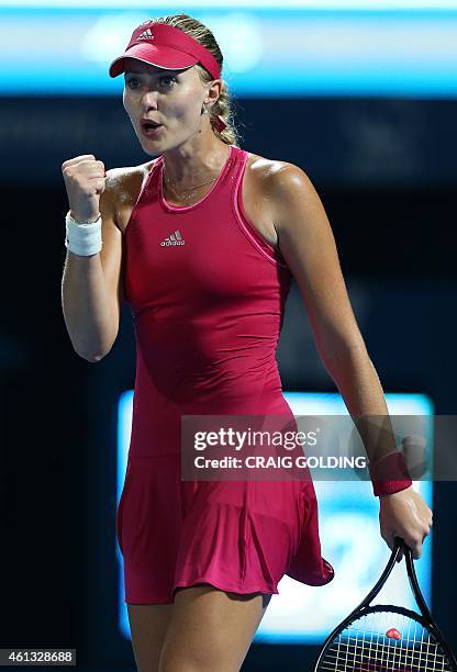 Kristina Mladenovic of France celebrates her victory against Johanna Konta of Britain on day one of the Sydney International tennis tournament in...