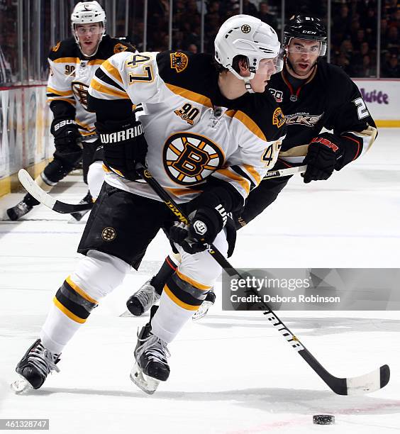 Torey Krug of the Boston Bruins handles the puck during the game against the Anaheim Ducks on January 7, 2014 at Honda Center in Anaheim, California.