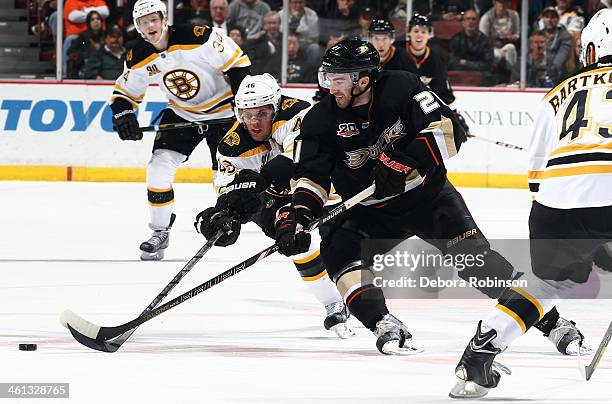 Kyle Palmieri of the Anaheim Ducks battles for the puck against David Krejci of the Boston Bruins on January 7, 2014 at Honda Center in Anaheim,...