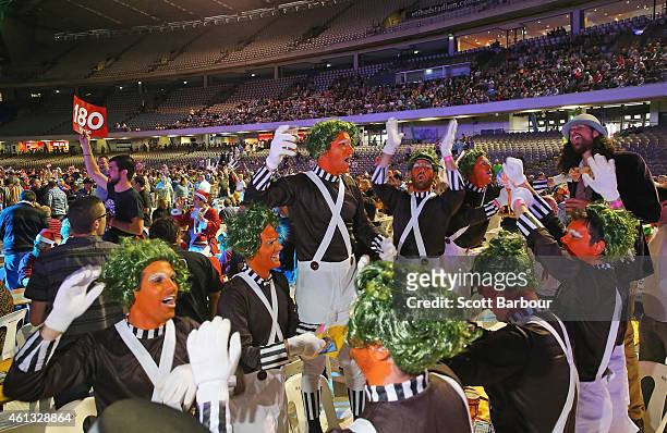 Spectators in fancy dress celebrate in the crowd during the Invitational Darts Challenge at Etihad Stadium on January 10, 2015 in Melbourne,...
