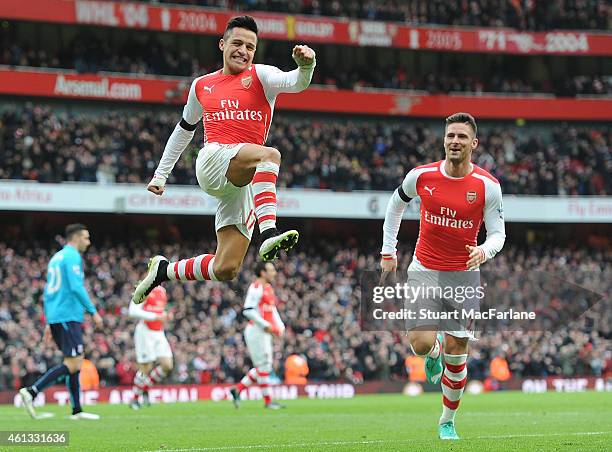 Alexis Sanchez celebrates scoring the 2nd Arsenal goal during the Barclays Premier League match between Arsenal and Stoke City at Emirates Stadium on...