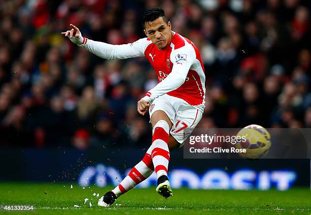 Alexis Sanchez of Arsenal scores his team's third goal during the Barclays Premier League match between Arsenal and Stoke City at Emirates Stadium on...