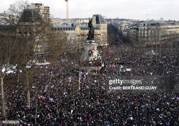 People take part on the Place de la Republique in Paris in a Unity rally "Marche Republicaine" on January 11, 2015 in tribute to the 17 victims of a...