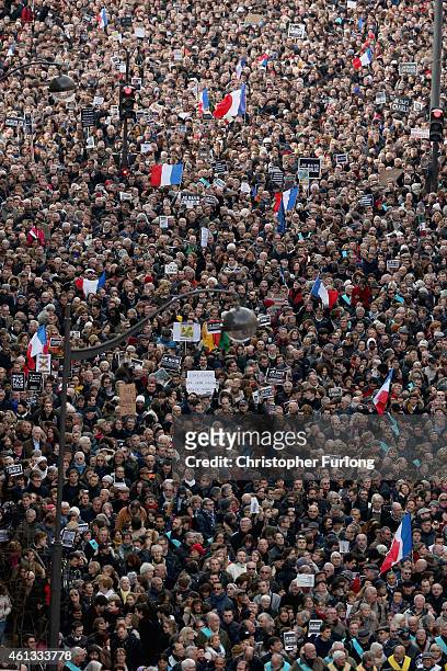 Demonstrators make their way along Boulevrd Voltaire in a unity rally in Paris following the recent terrorist attacks on January 11, 2015 in Paris,...
