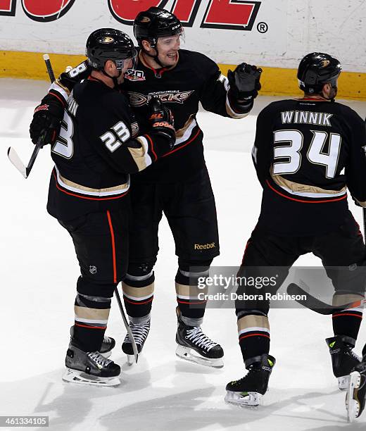 Francois Beauchemin, Mark Fistric and Daniel Winnik of the Anaheim Ducks celebrate during the game against the Boston Bruins on January 7, 2014 at...