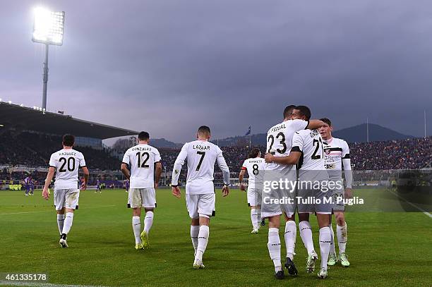 Robin Quaison of Palermo celebrates with team mates after scoring the equalizing goal during the Serire A match between ACF Fiorentina and US Citta...