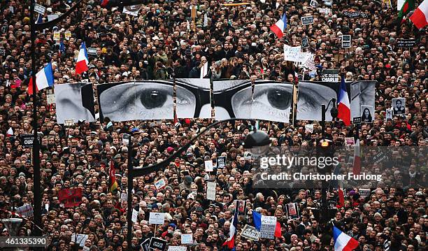 Demonstrators make their way along Boulevrd Voltaire in a unity rally in Paris following the recent terrorist attacks on January 11, 2015 in Paris,...