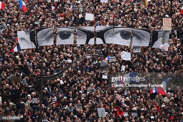 Demonstrators make their way along Boulevrd Voltaire in a unity rally in Paris following the recent terrorist attacks on January 11, 2015 in Paris,...