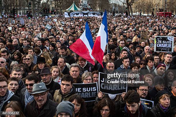 Demonstrators make their way along Place de la Republique during a mass unity rally following the recent terrorist attacks on January 11, 2015 in...