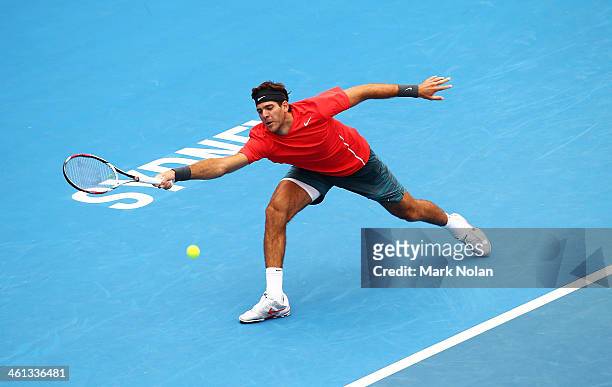 Juan Martin Del Potro of Argentina plays a forehand in his match against Nicolas Mahut of France during day four of the 2014 Sydney International at...