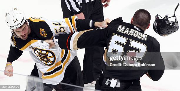 Patrick Maroon of the Anaheim Ducks and Adam McQuaid of the Boston Bruins fight during the game on January 7, 2014 at Honda Center in Anaheim,...