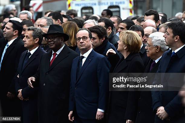 Nicolas Sarkozy, Ibrahim boubakar Keita, Francois Hollande, Angela Merkel, Mahmoud Abbas and Matteo Renzi walk during a mass unity rally following...