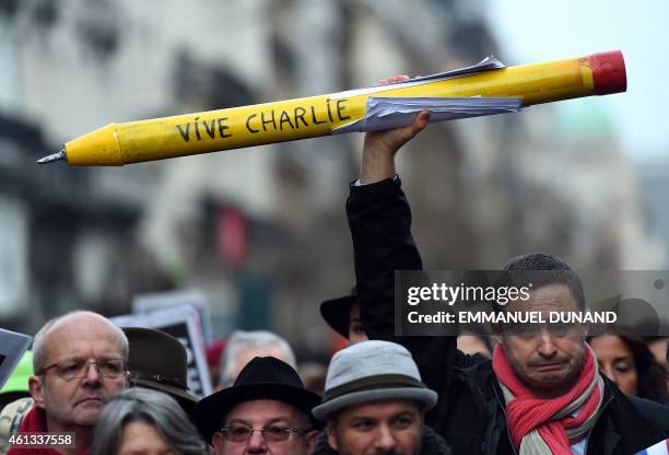 Some 20,000 people march on January 11, 2015 in Brussels in tribute to the 17 victims of the three-day killing spree in France that ended on January...