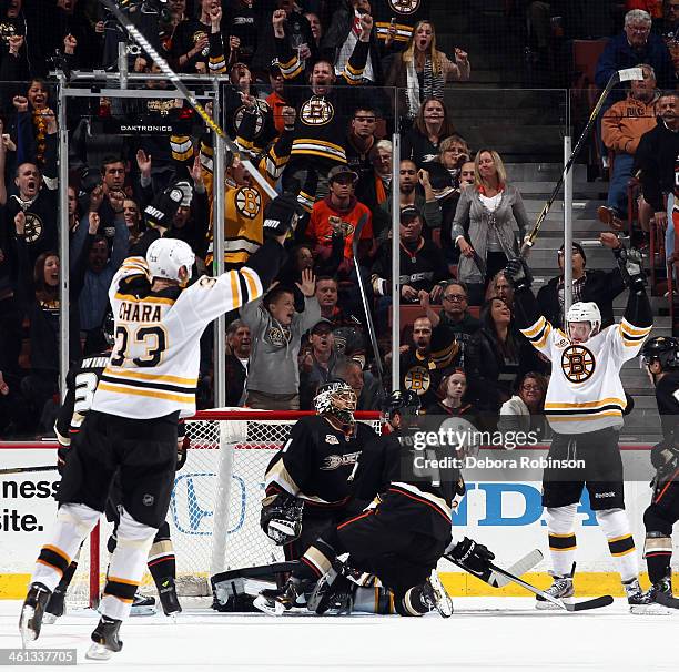 Carl Soderberg and Zdeno Chara of the Boston Bruins celebrate a team goal against the Boston Bruins on January 7, 2014 at Honda Center in Anaheim,...