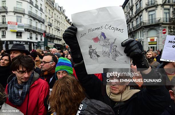 Some 20,000 people march on January 11, 2015 in Brussels in tribute to the 17 victims of the three-day killing spree in France that ended on January...